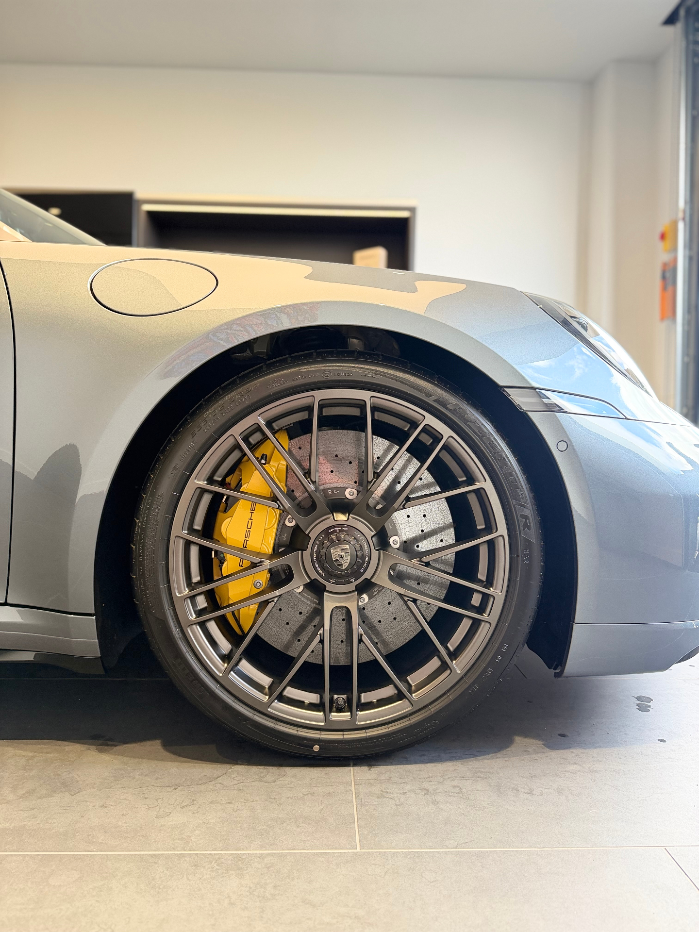 Porsche 911 GT3 wheel with yellow ceramic brake caliper