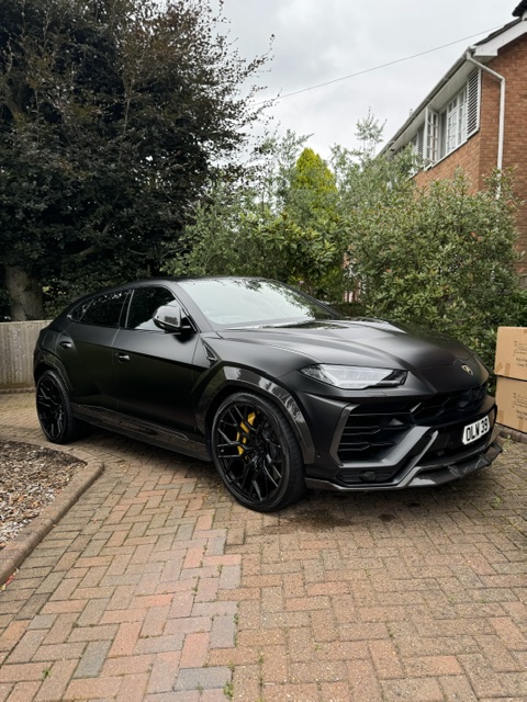 Black Lamborghini Urus front three-quarter