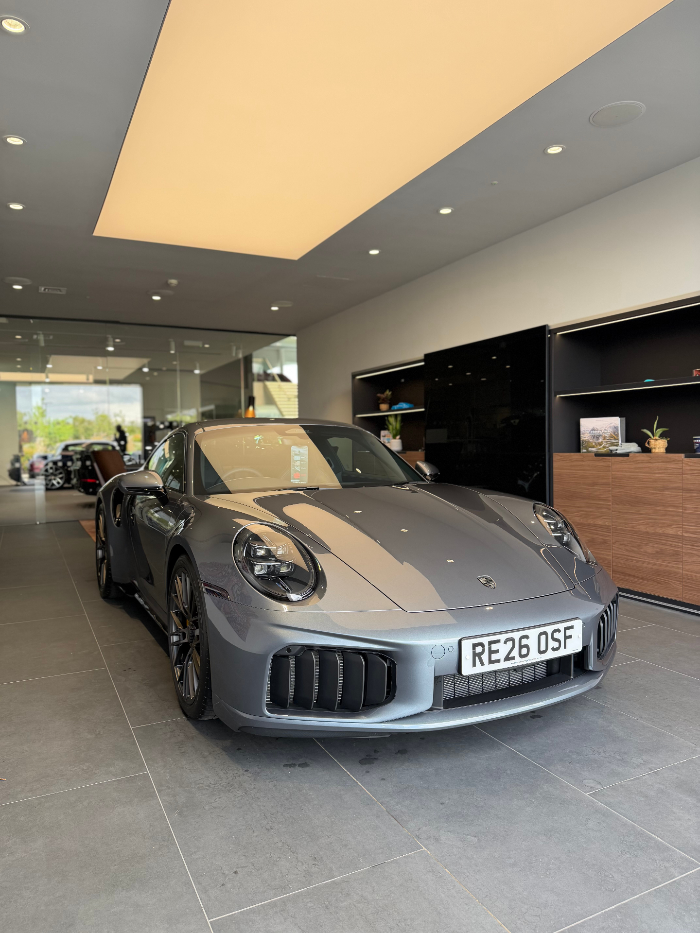 Grey Porsche 911 Turbo in Porsche showroom